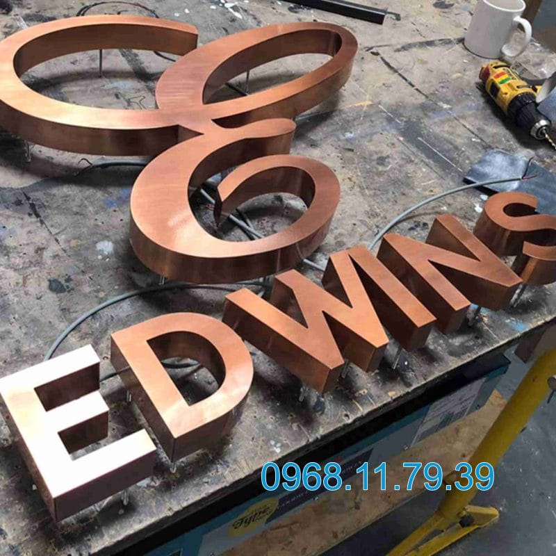 Gia công logo inox hồng xước HCM